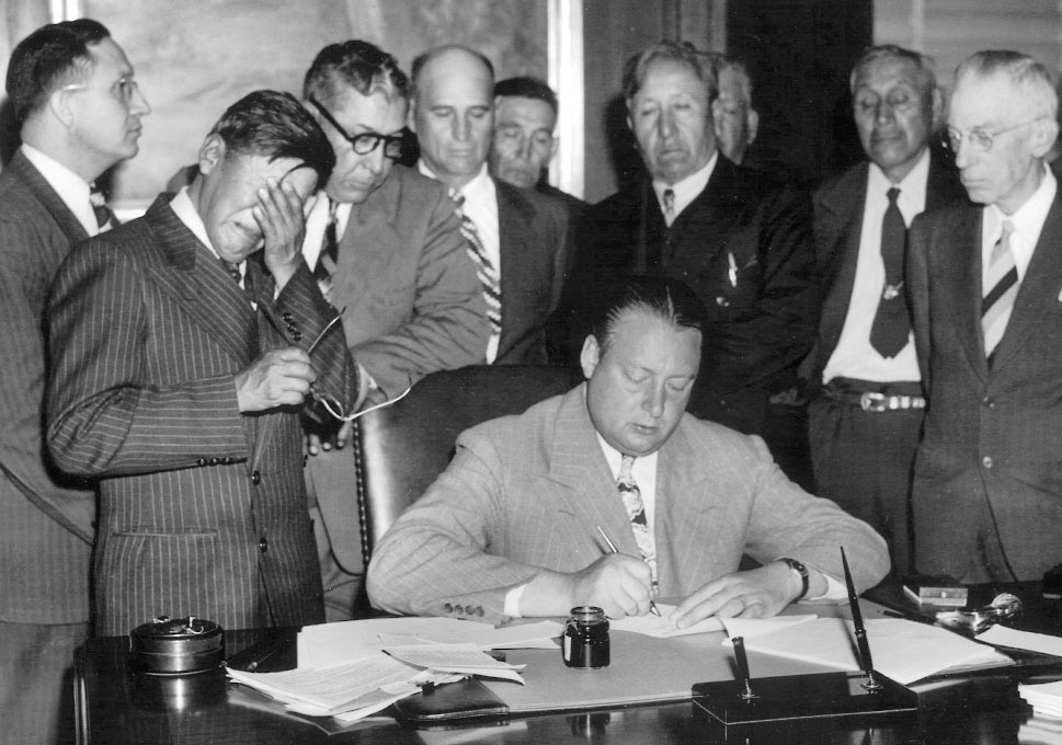 George Gillette c. 1948 chairman of the Mandan, Arikara, and Hidatsa tribes of North Dakota, crying at Garrison Dam signing.